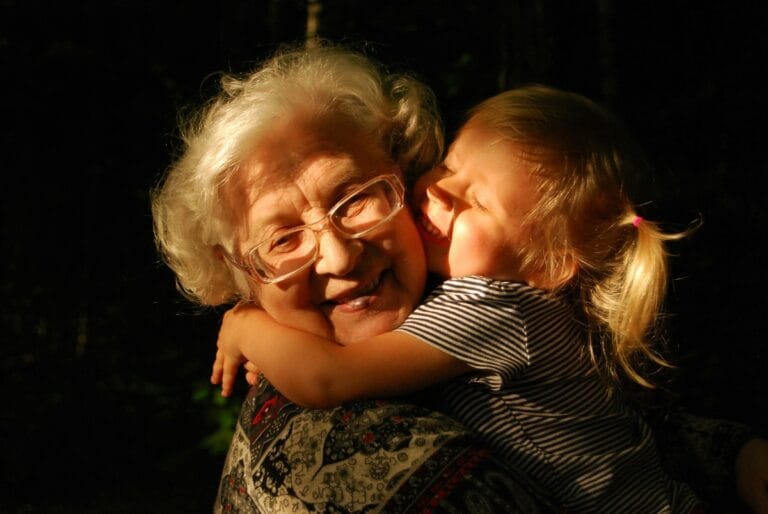 Grandaughter hugging her grandmother